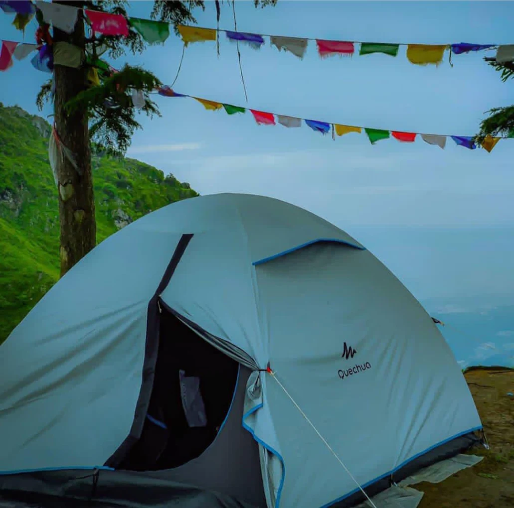 Tent with prayer flags and valley view