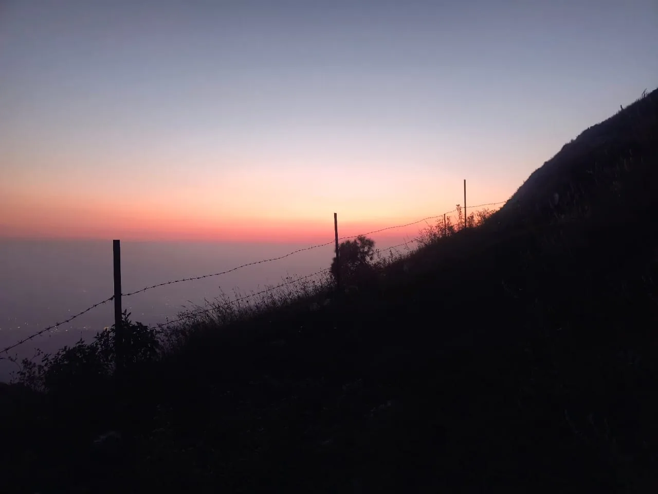 Dusk view with fence silhouette