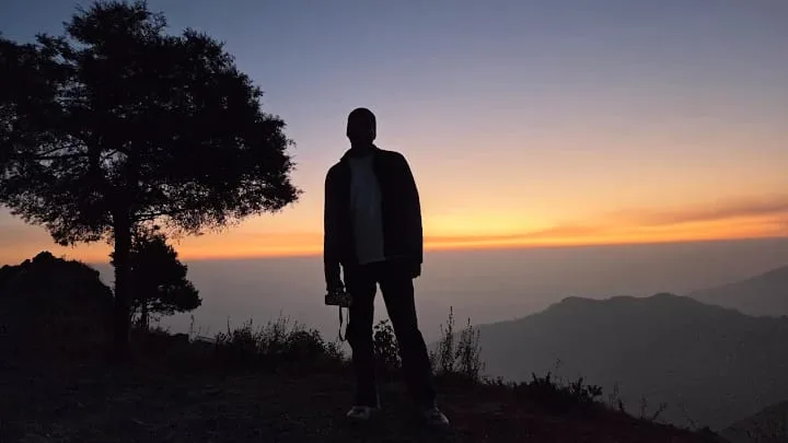 Silhouette at sunset with tree
