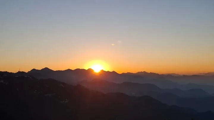 Golden sunrise over mountain peaks